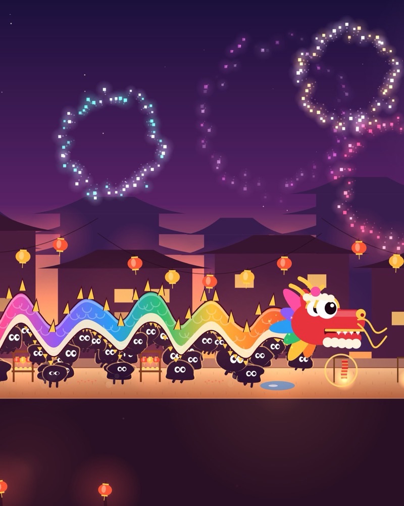 A rainbow festival dragon carried by creatures under fireworks